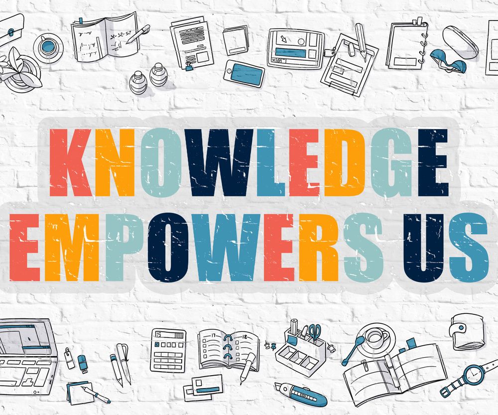 Knowledge Empowers Us Concept. Multicolor Inscription on White Brick W